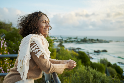 Woman Smiling at Railing_ Learning the Difference in Bad Days vs Depression