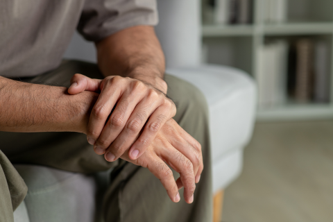 Man Clasping Hands in Therapy