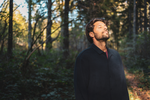 Man in Forest Enjoying Sunshine