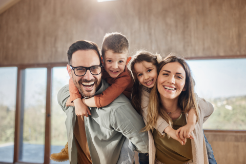 Happy Family Smiling at Camera