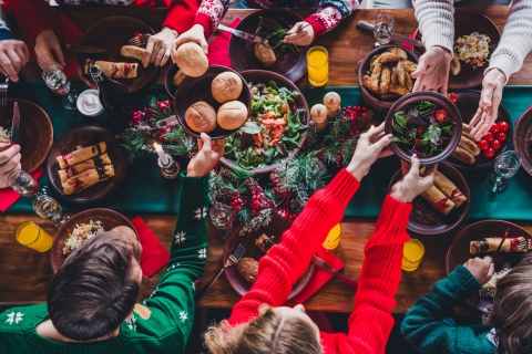 Family gathered around a dinner table at the holidays