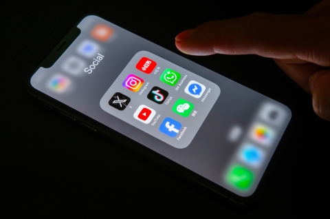 Phone showing different social media apps on the screen