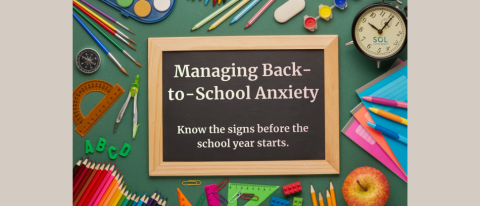 Chalkboard with words about managing school anxiety on a background of school supplies